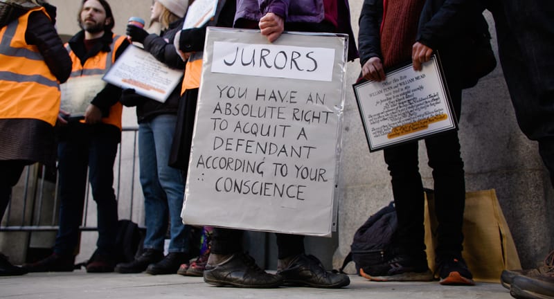 A banner reading: jurors, you have an absolute right to acquit a defendant according to your conscience
